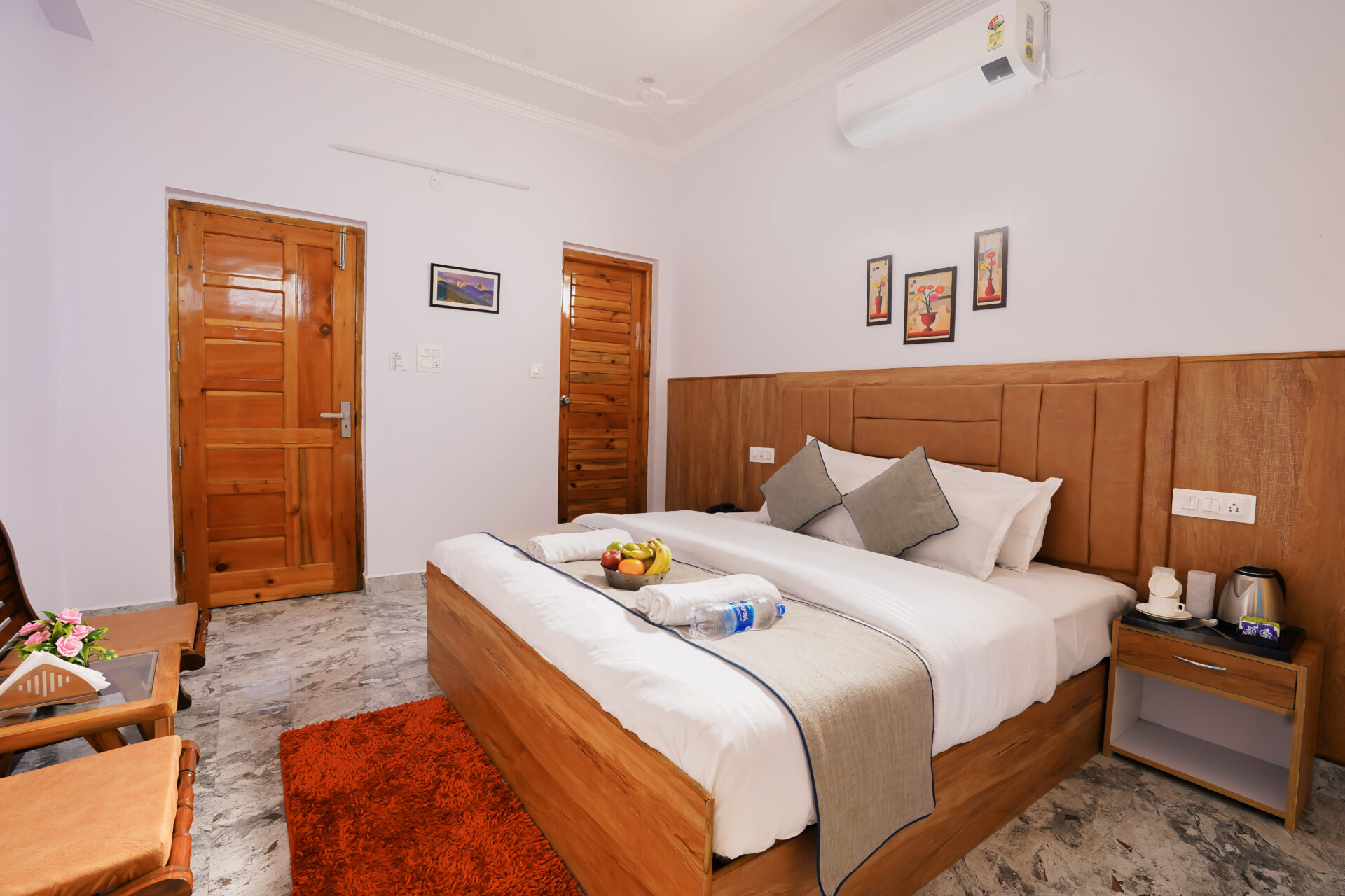 Deluxe Room at Hotel Sparrow Dharamshala. Double bed, city-facing balcony, work desk and smart TV